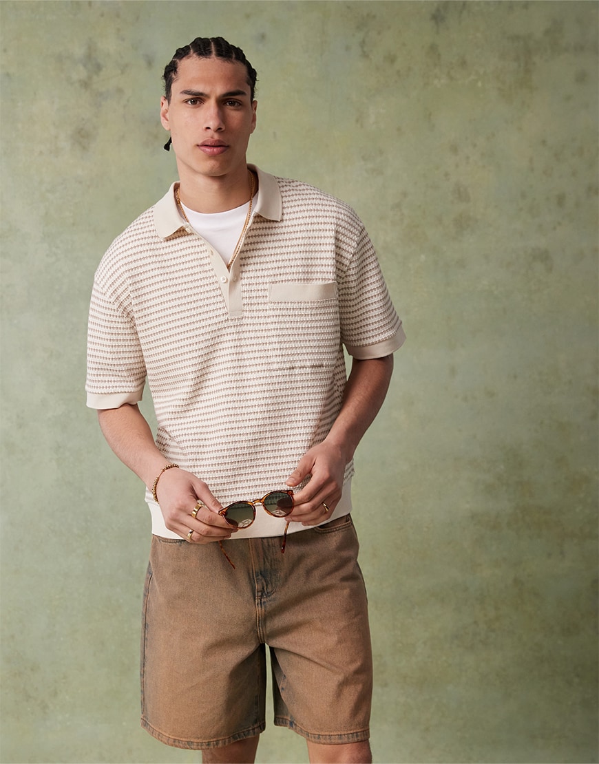 Man wearing a striped shirt and shorts
