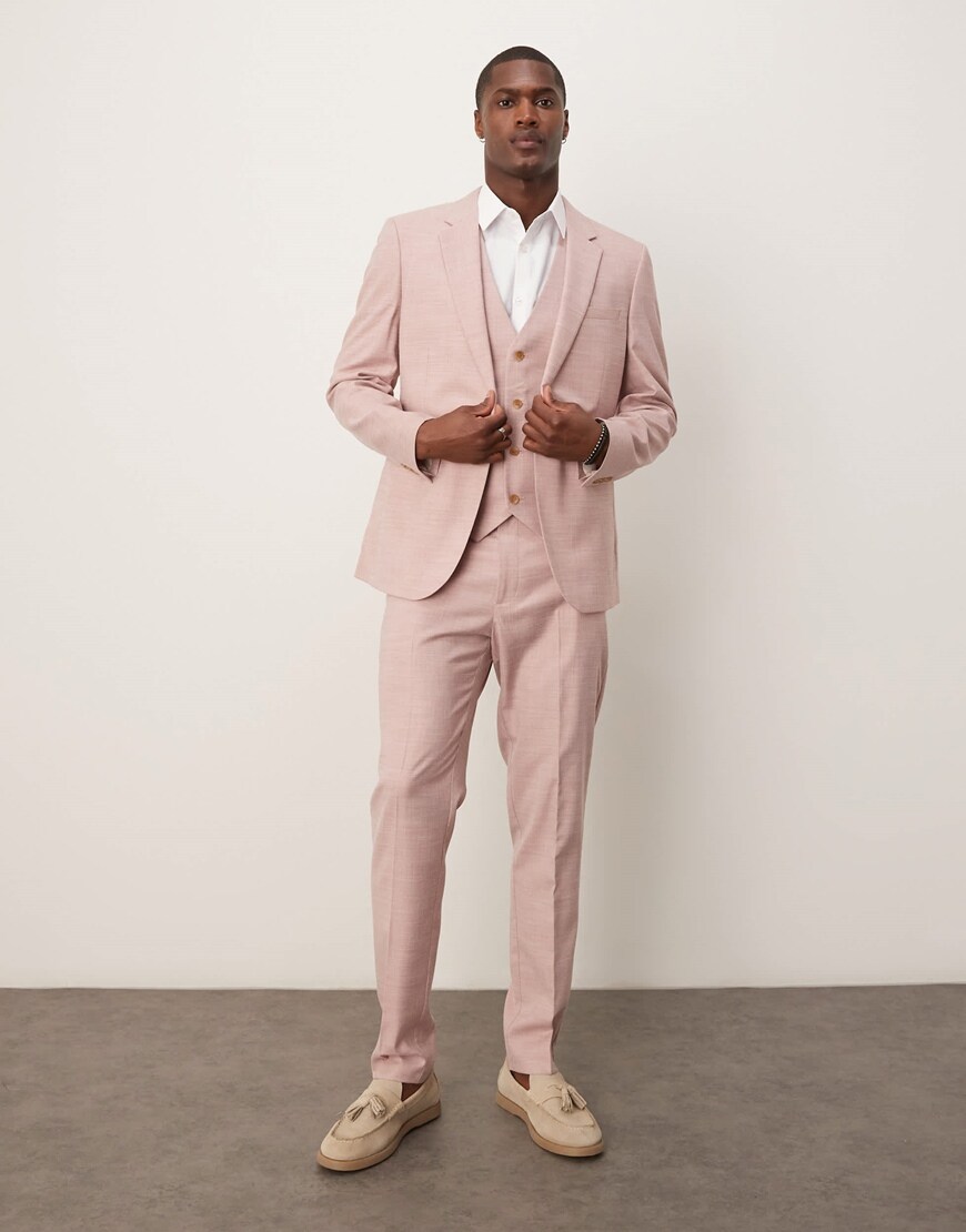 Model wearing a pink suit