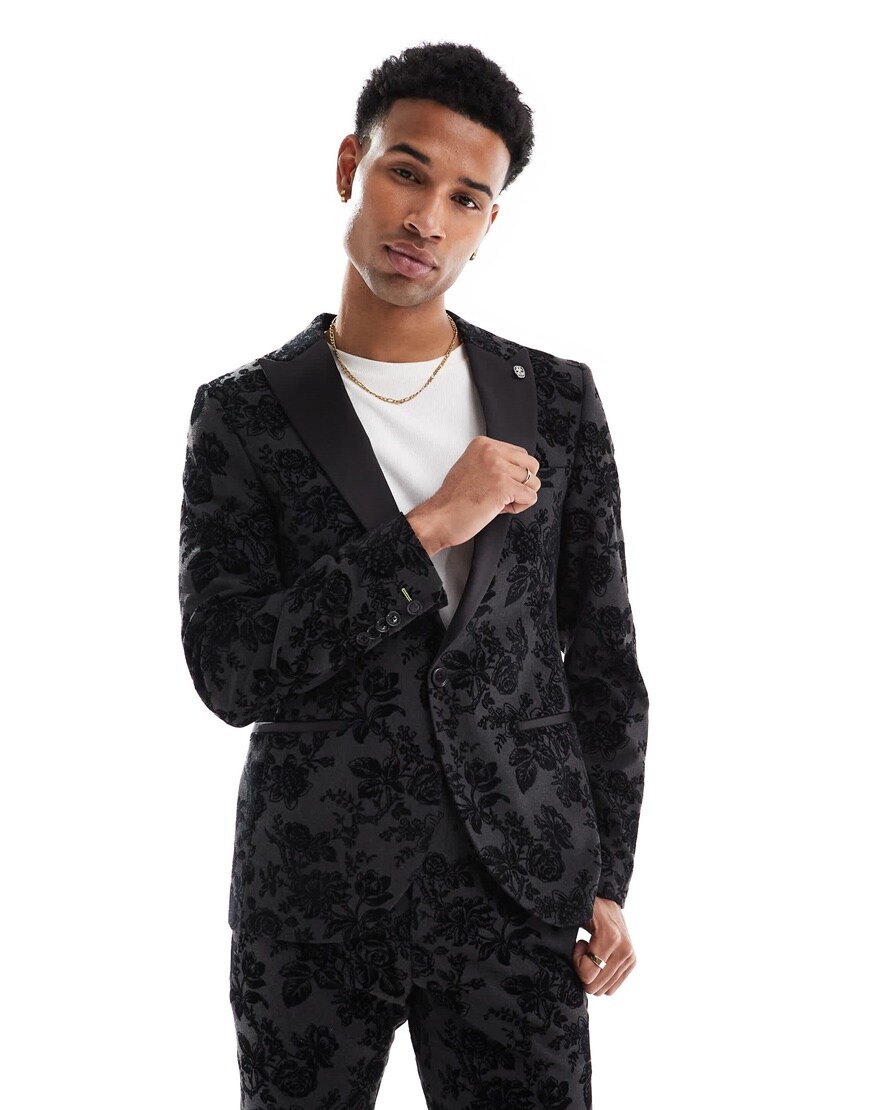 Model wearing a floral black suit jacket