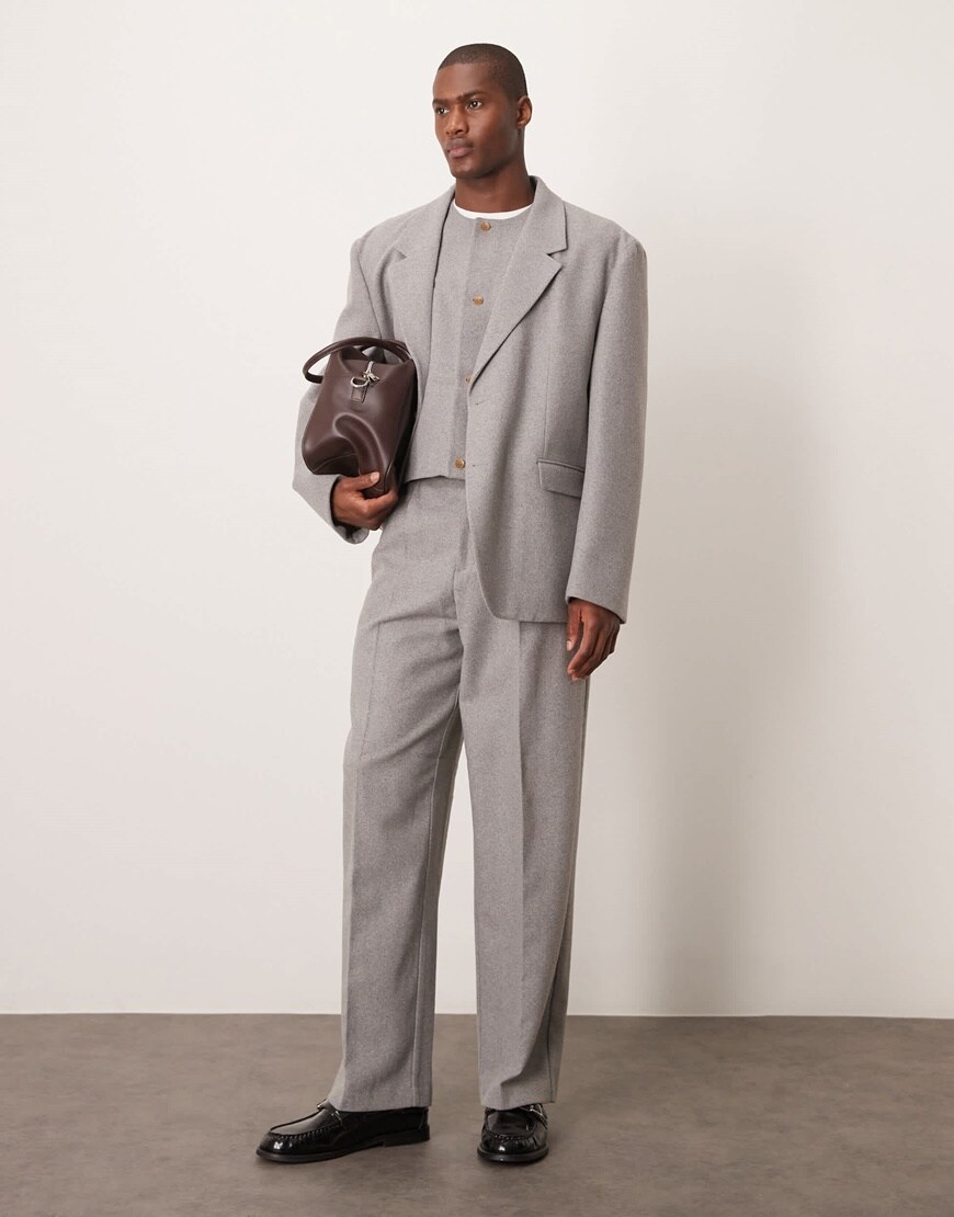 Model wearing an oversized grey suit