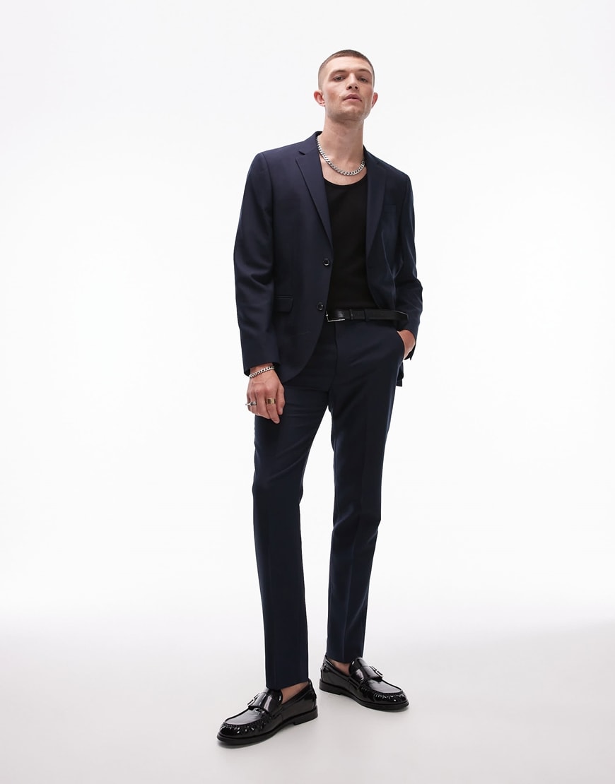 Model wearing a navy suit