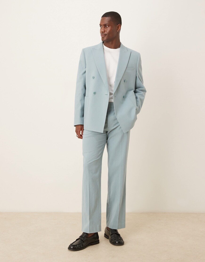 Model wearing a pastel blue suit