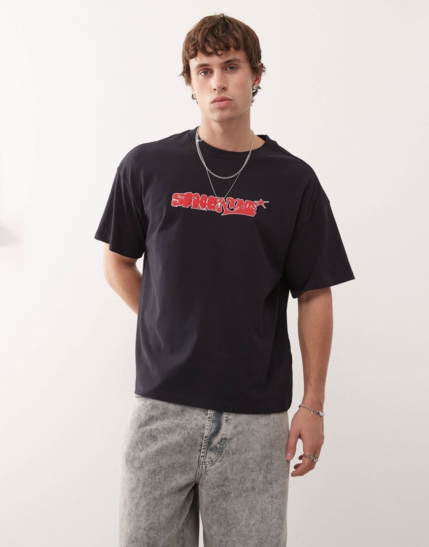 A model wearing a black graphic print t-shirt