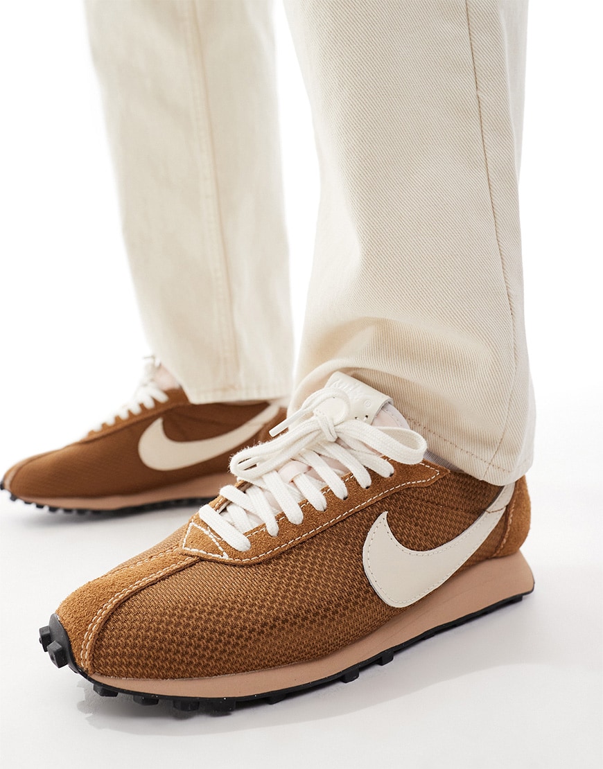 A model wearing brown textured trainers