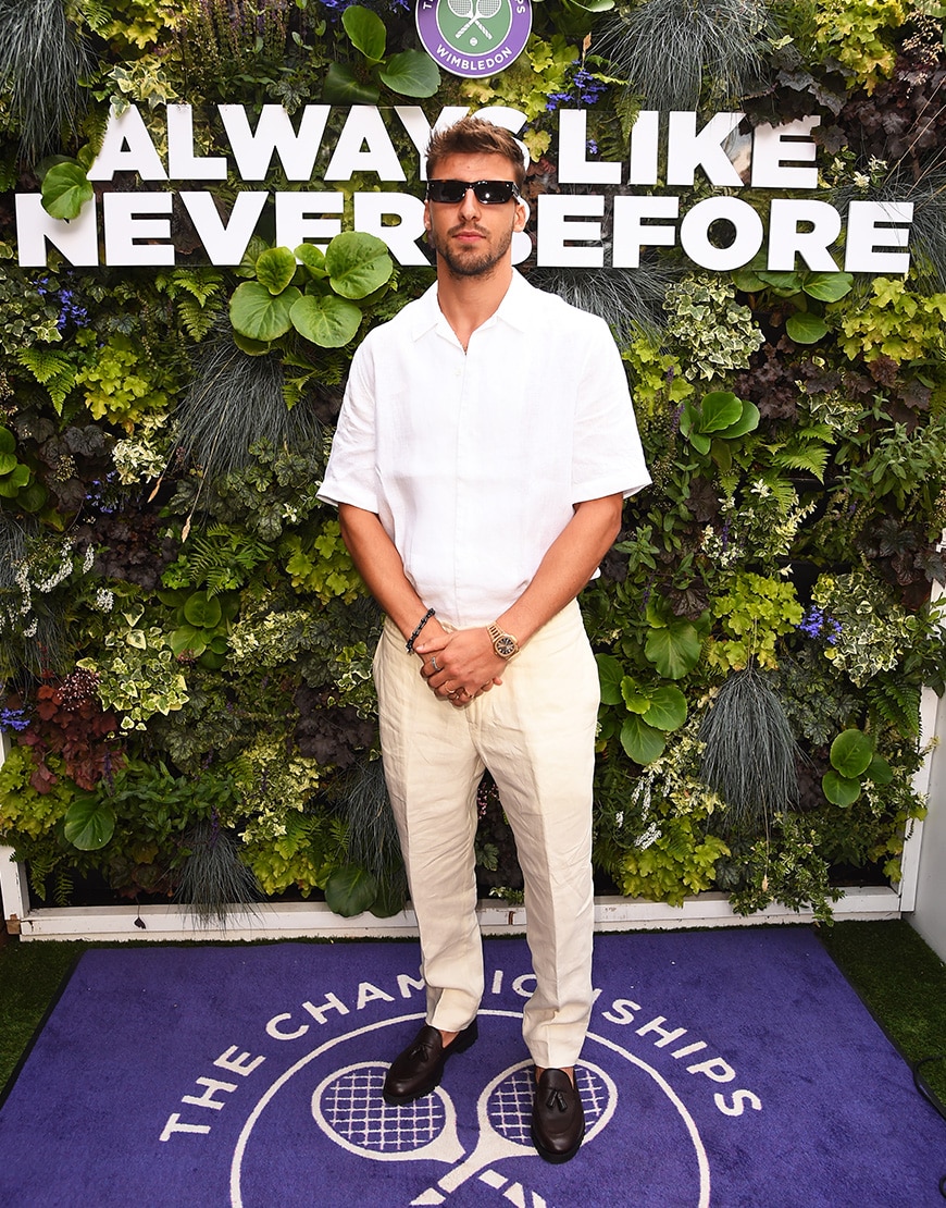 Ruben Dias wearing all-white outfit and loafers