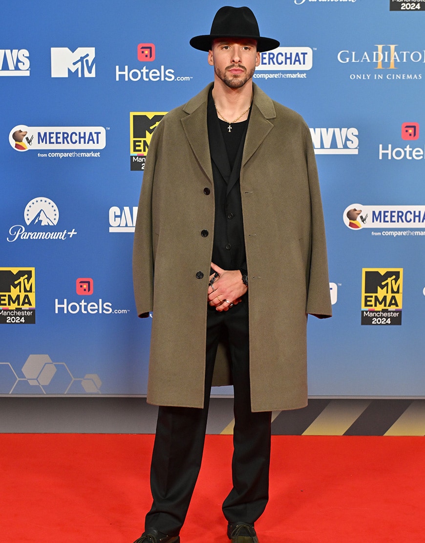 Ruben Dias wearing statement hat and jacket