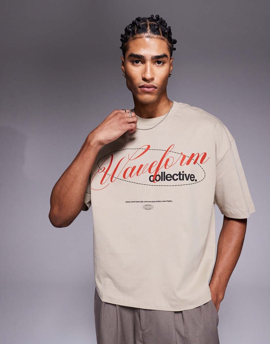 A model wearing a beige printed t shirt