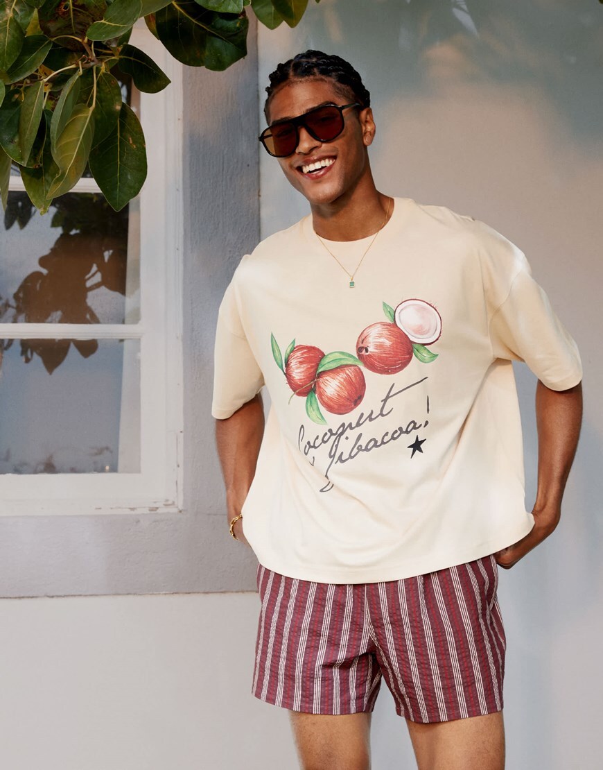 A model wearing a fruit print T-shirt