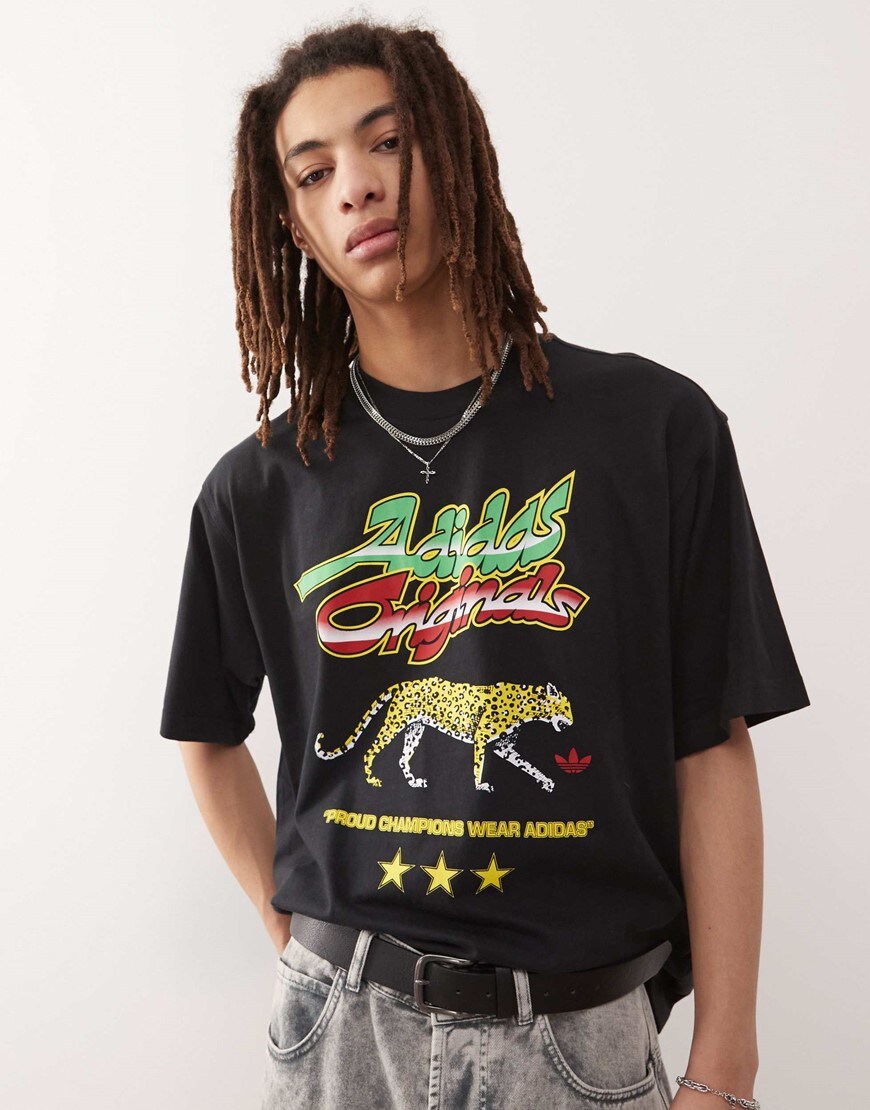 A model wearing a black adidas printed tee