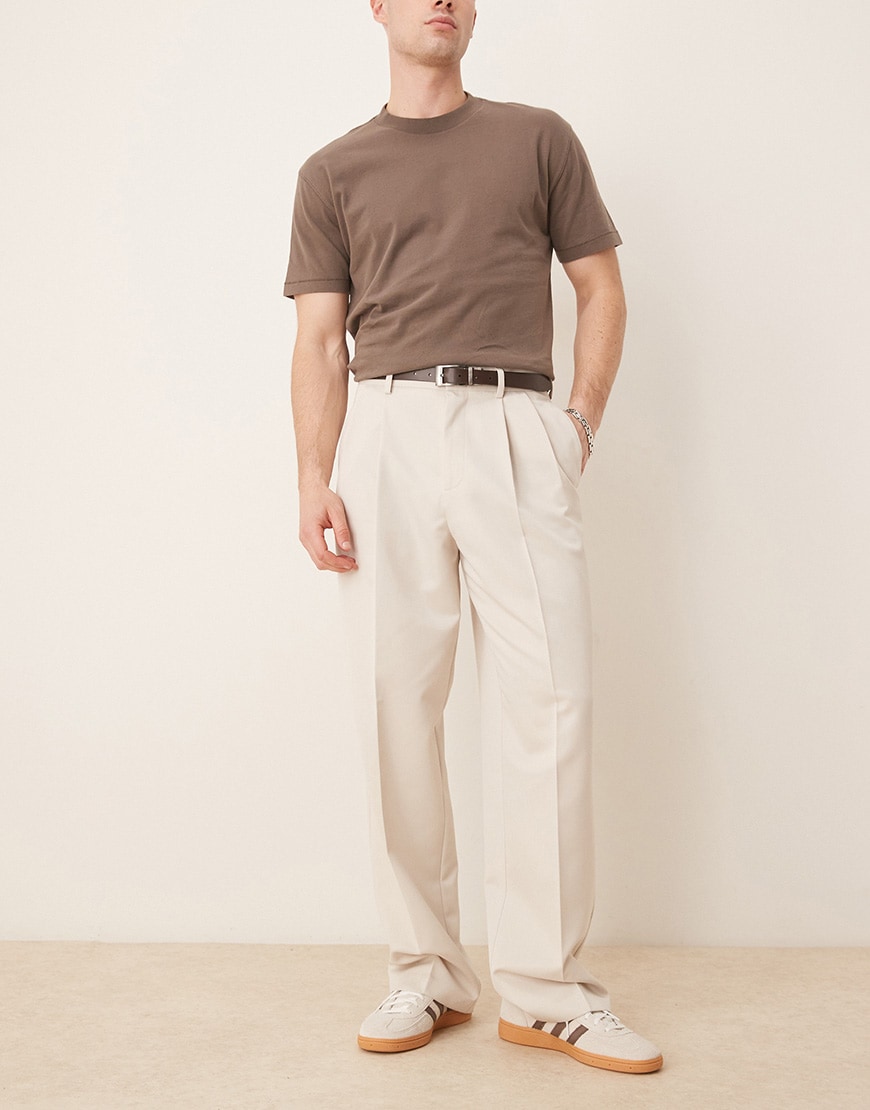 A model wearing cream trousers