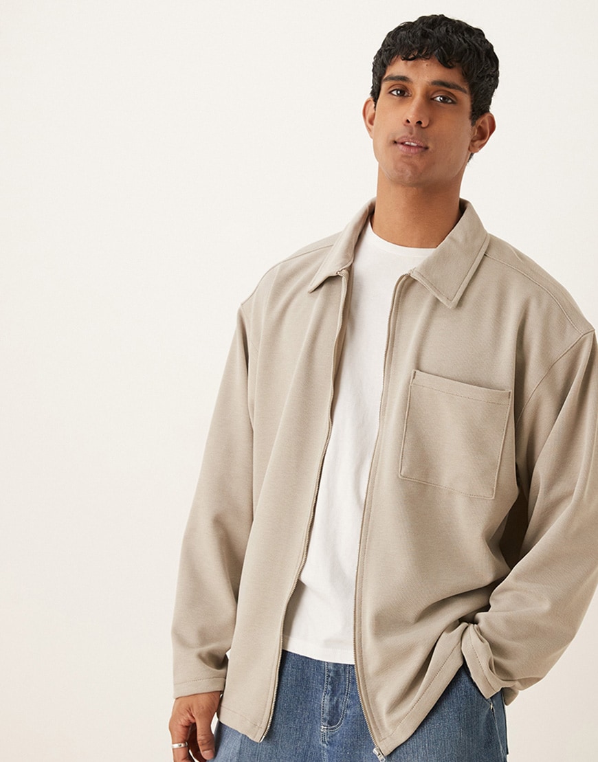 A model wearing a tan overshirt