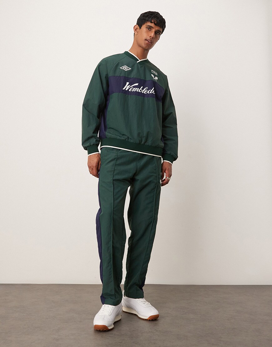 A model wearing a green Wimbledon tracksuit