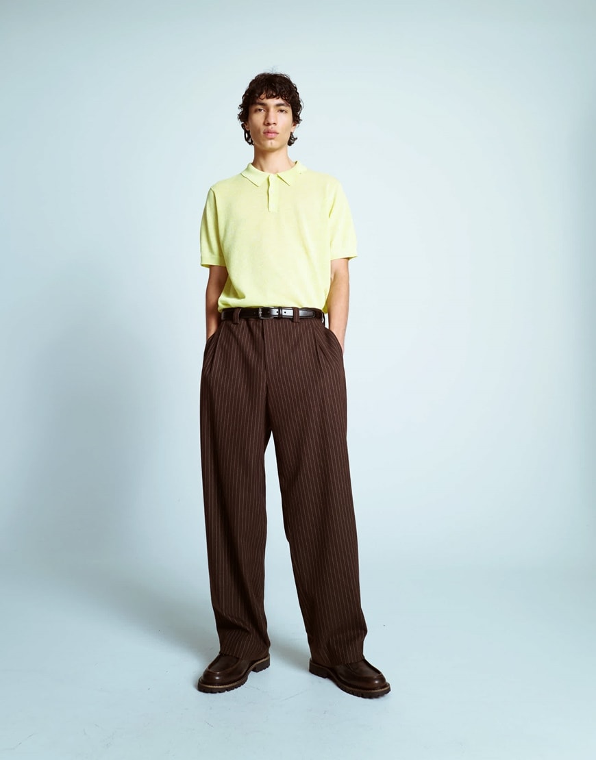 A model wearing brown striped trousers