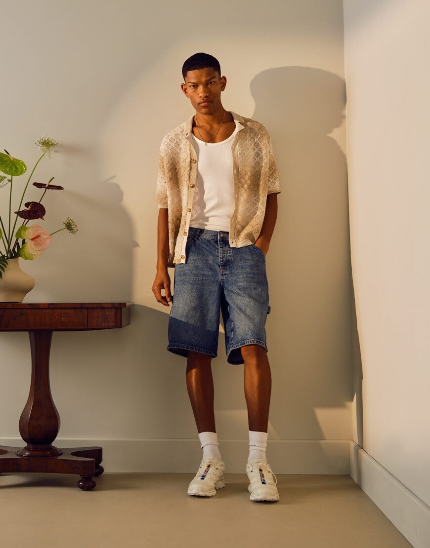 A model wearing denim jorts