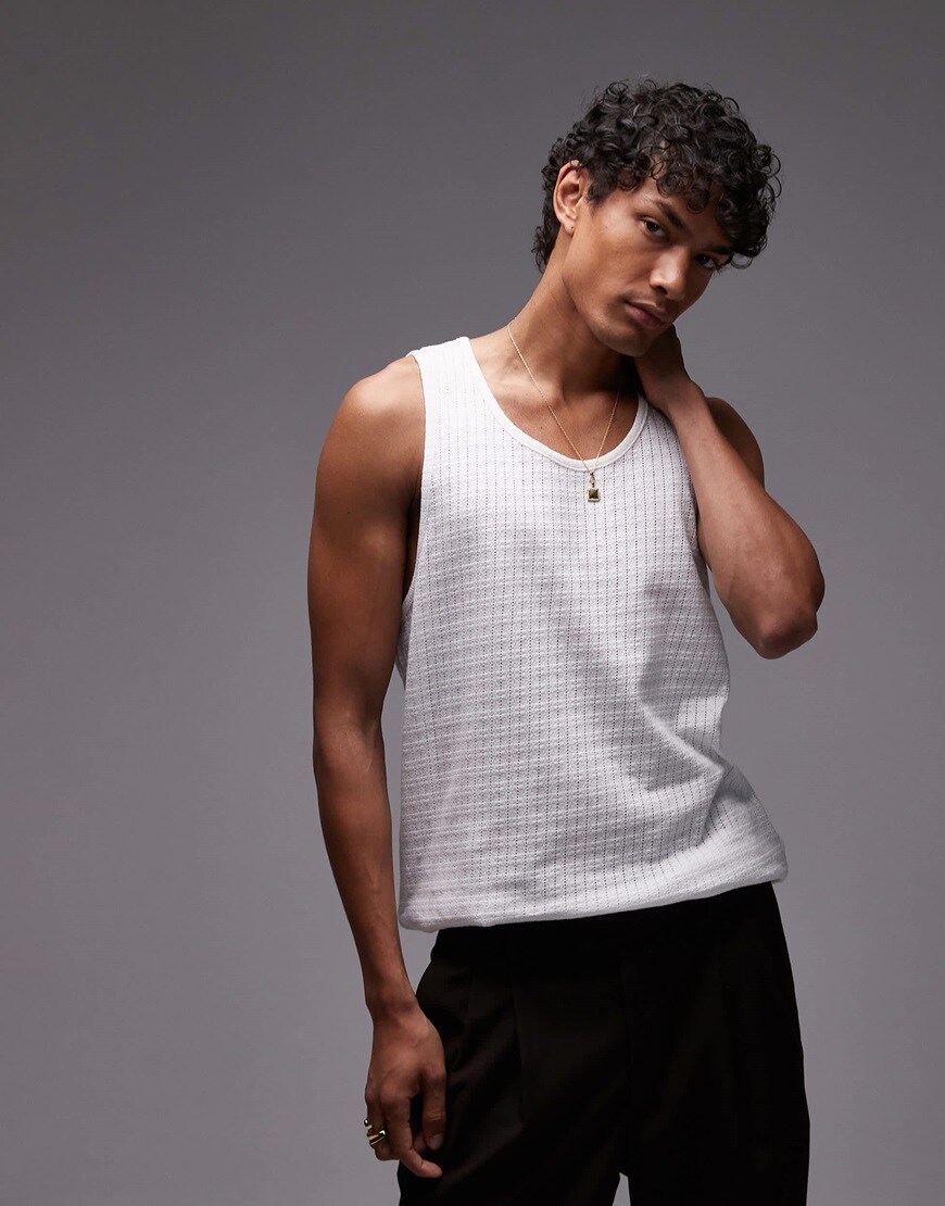 A model wearing a white vest