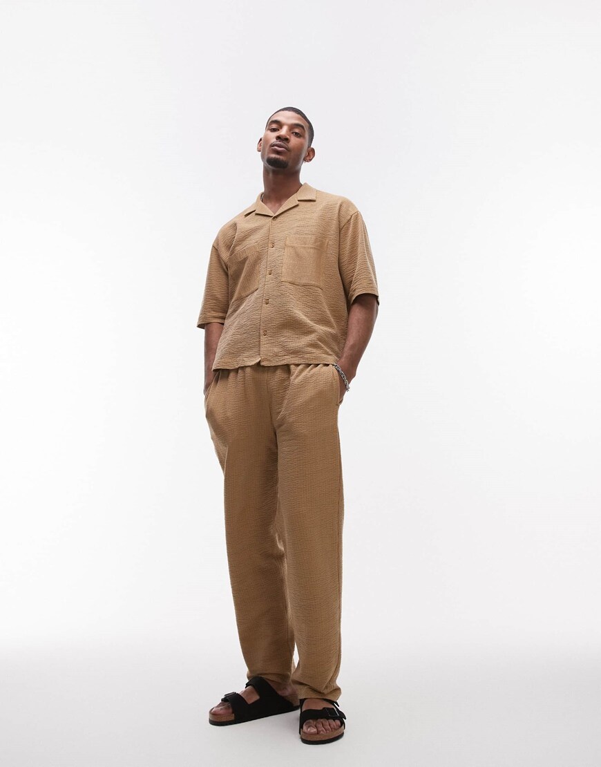 A model wearing a mustard co-ord