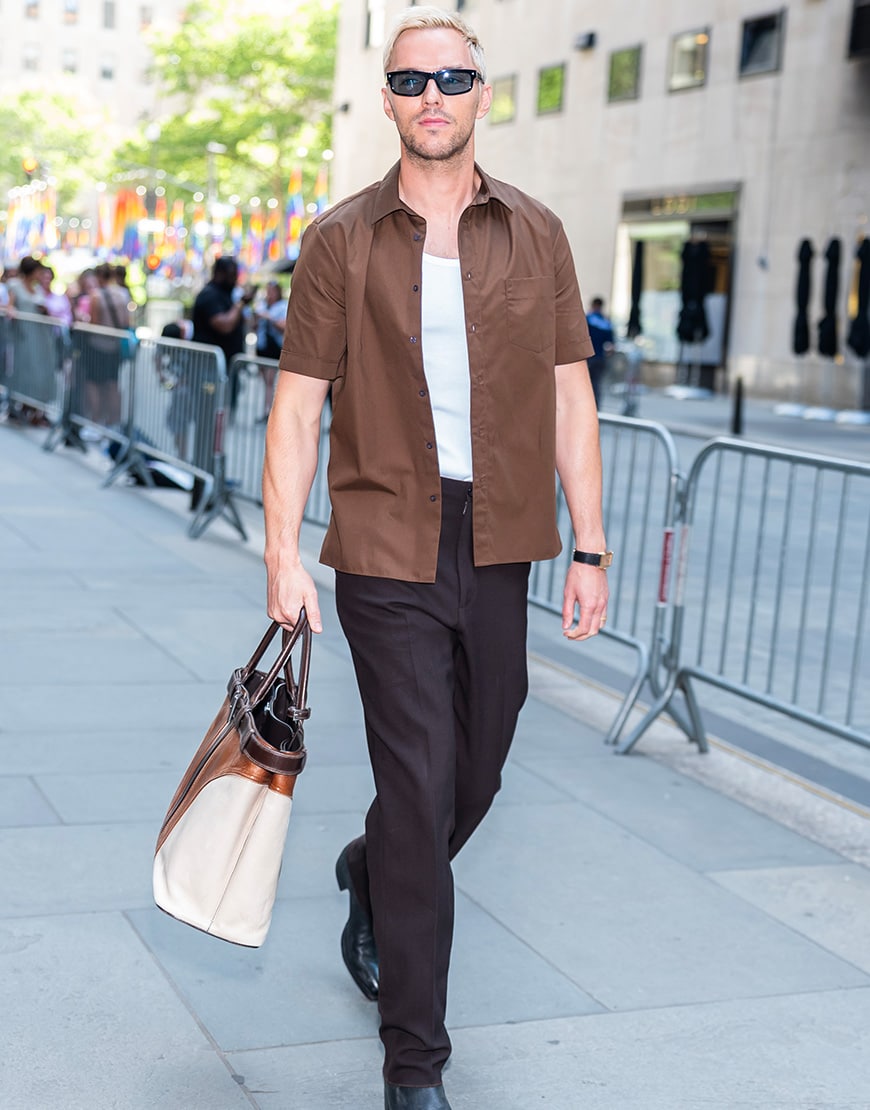 Nicholoas Hoult wearing a brown shirt and tailored trousers | ASOS Style Feed