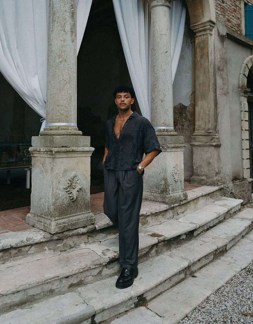 Man in all-black outfit