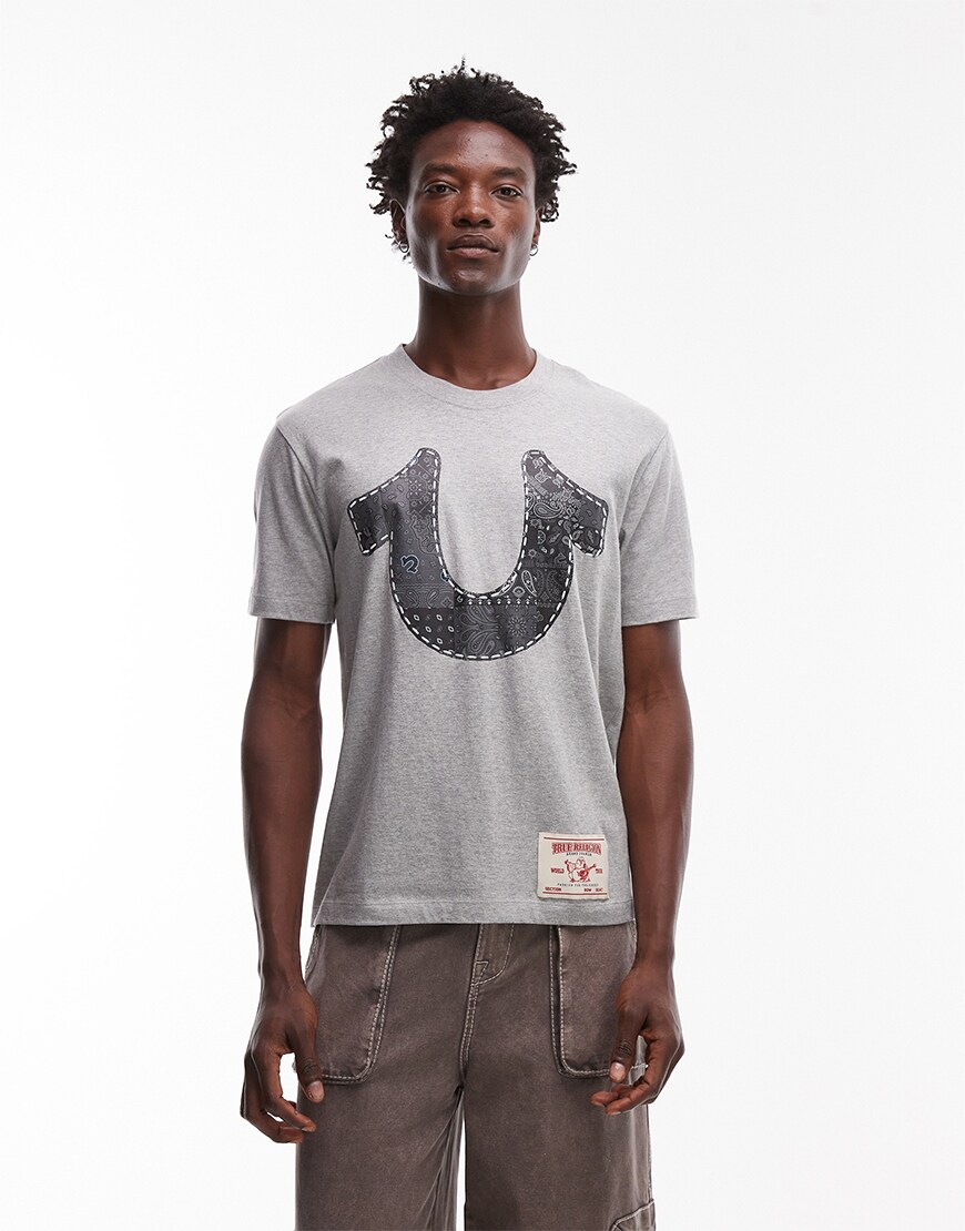 Model wearing a grey True Religion t-shirt