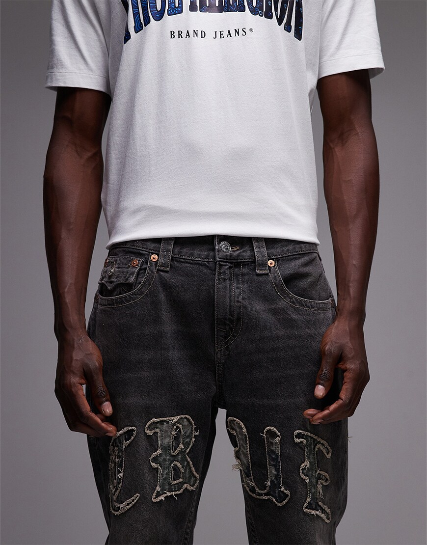 Jeans with 'TRUE' logo