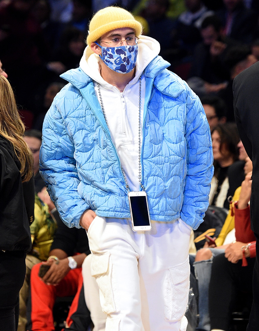 Bad Bunny wearing a blue puffer jacket