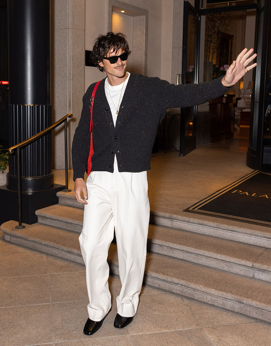 Jacob Elordi wearing a black cardigan