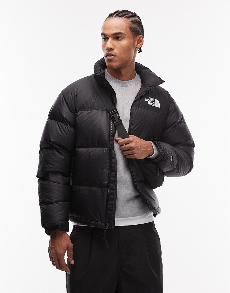 Man wearing a black puffer jacket
