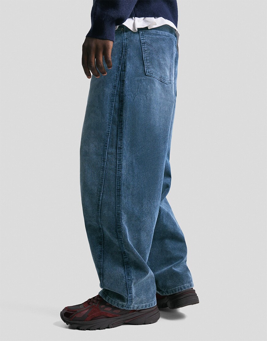 Man wearing blue corduroy trousers