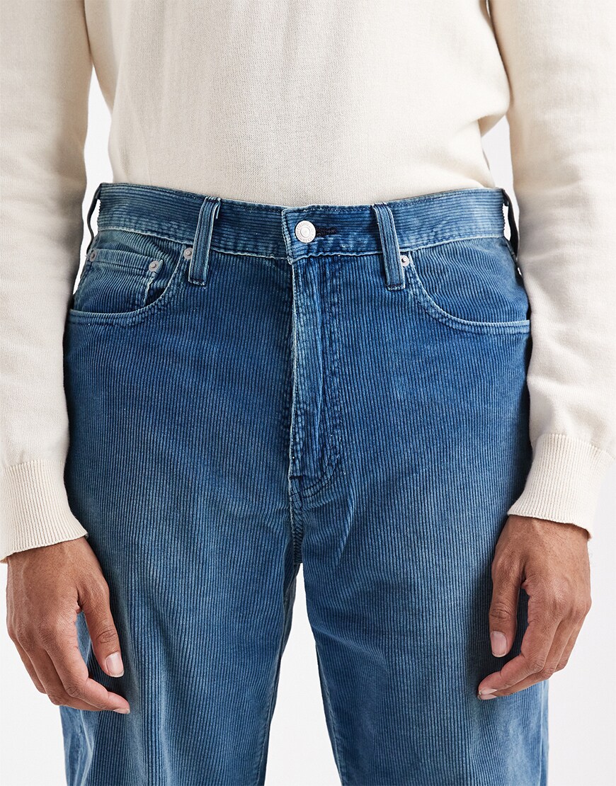 Man wearing blue corduroy trousers