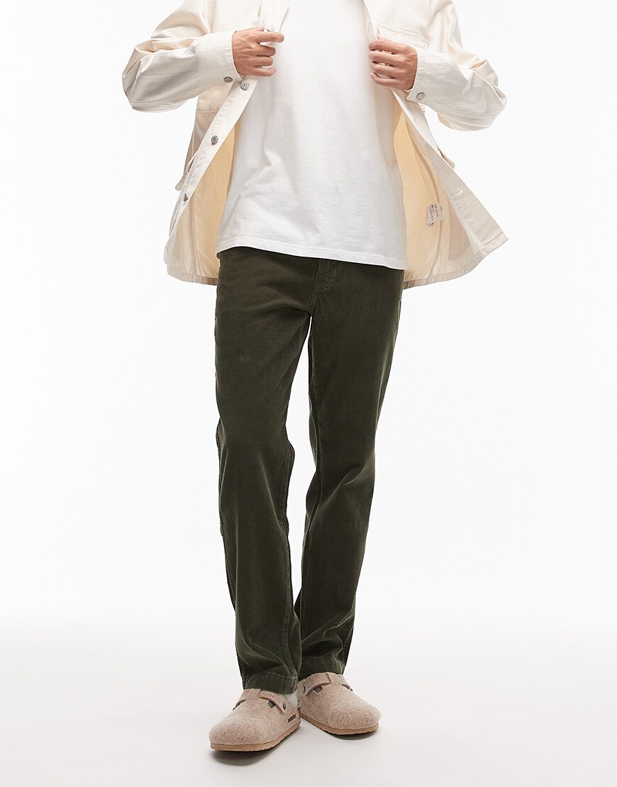 Man wearing corduroy trousers with a shirt