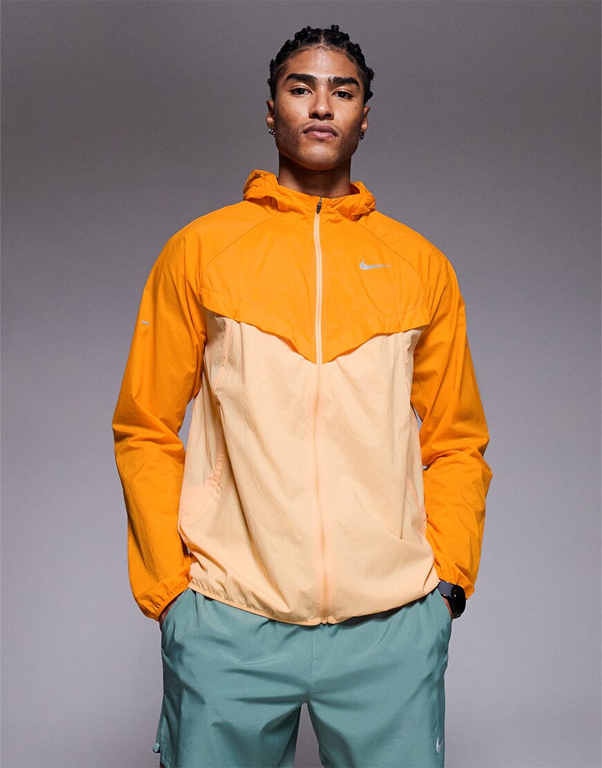 Man wearing an orange windbreaker
