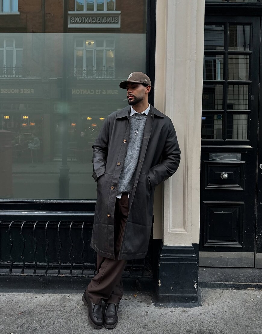 Man wearing a dark outfit