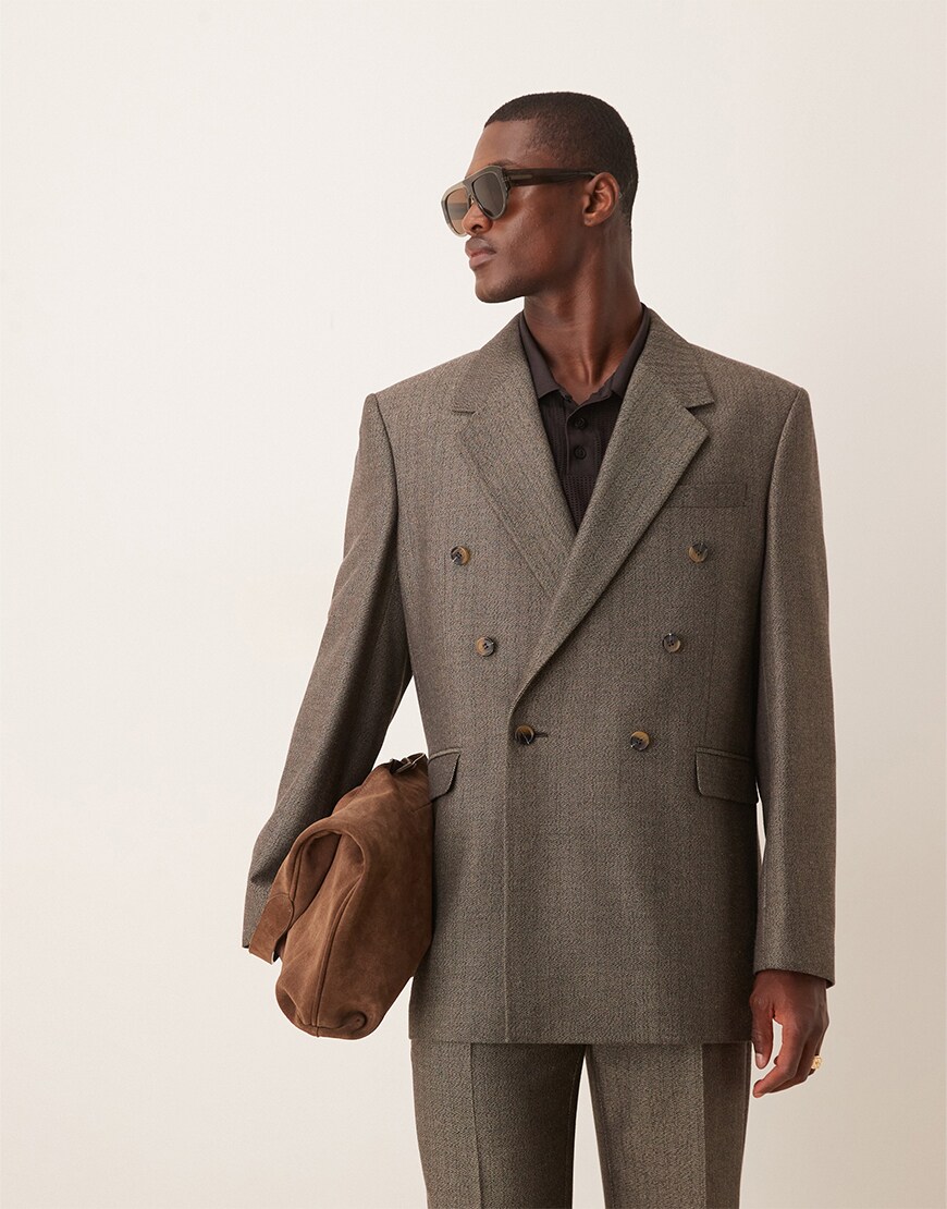 Man wearing a grey pinstripe suit