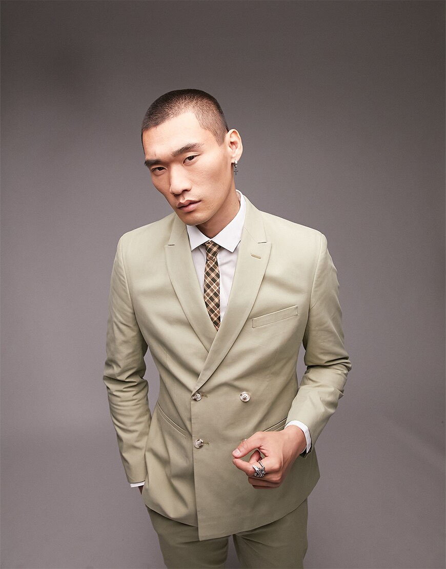 Man wearing a green suit