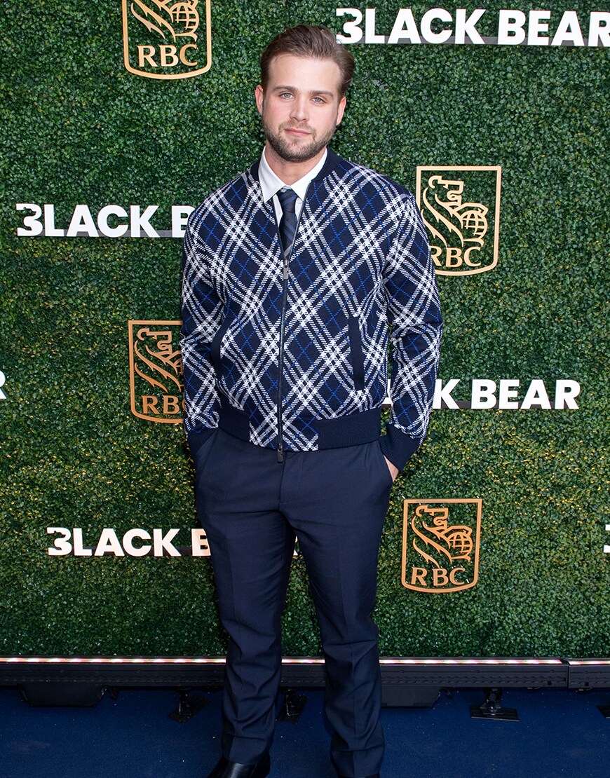 Leo Woodall wearing a tartan jacket