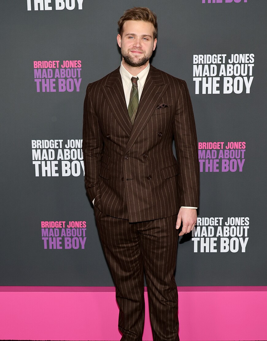 Leo Woodall wearing a brown suit