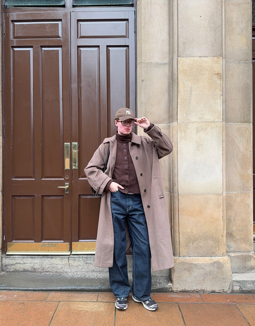 Man wearing a neutral outfit