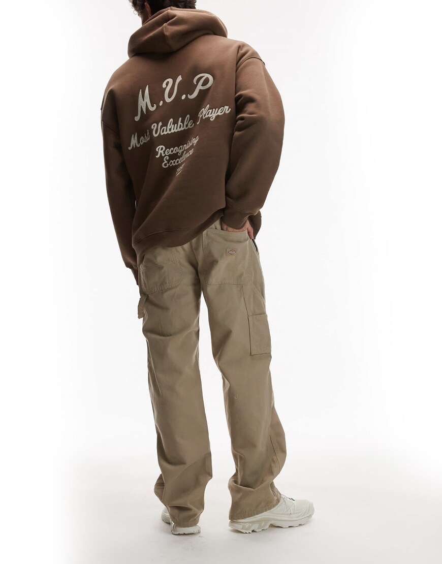 model wearing beige Dickies trousers|ASOS Style Feed