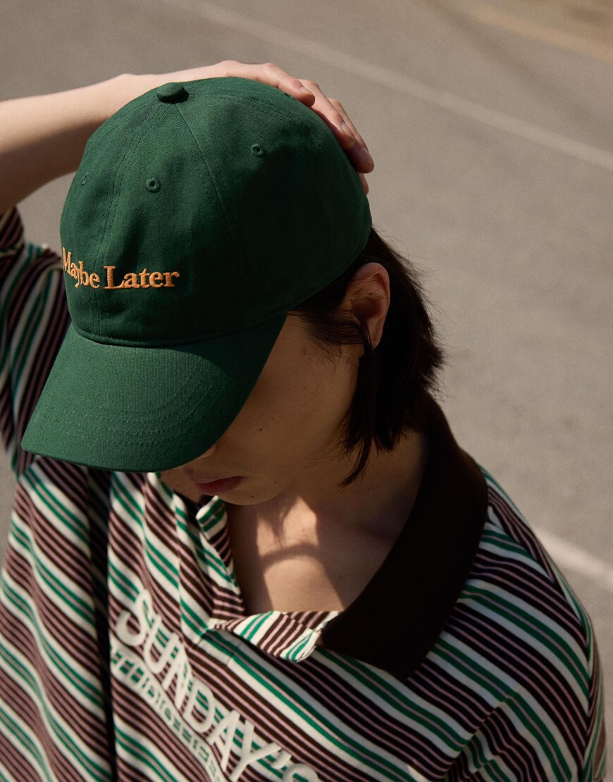 model wearing green baseball cap|ASOS Style Feed
