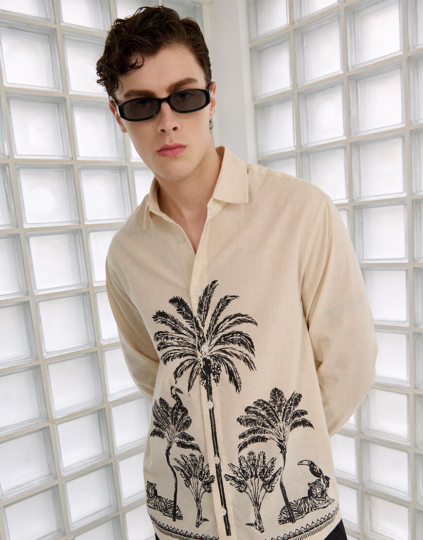 Man wearing a shirt with a summer graphic