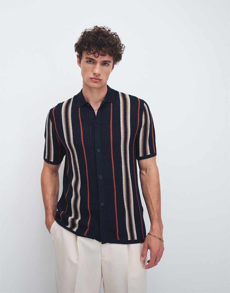 Man wearing a striped navy shirt