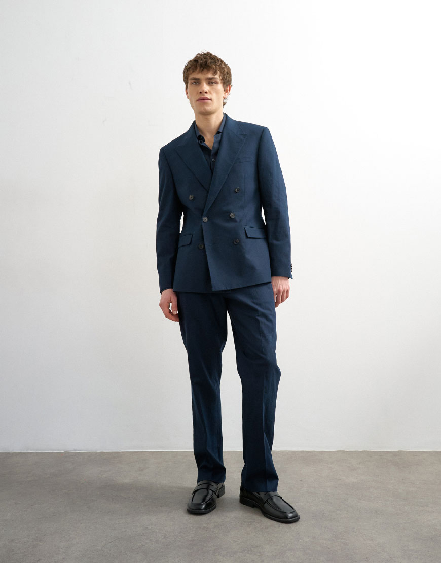A man wearing a navy double breasted suit | ASOS