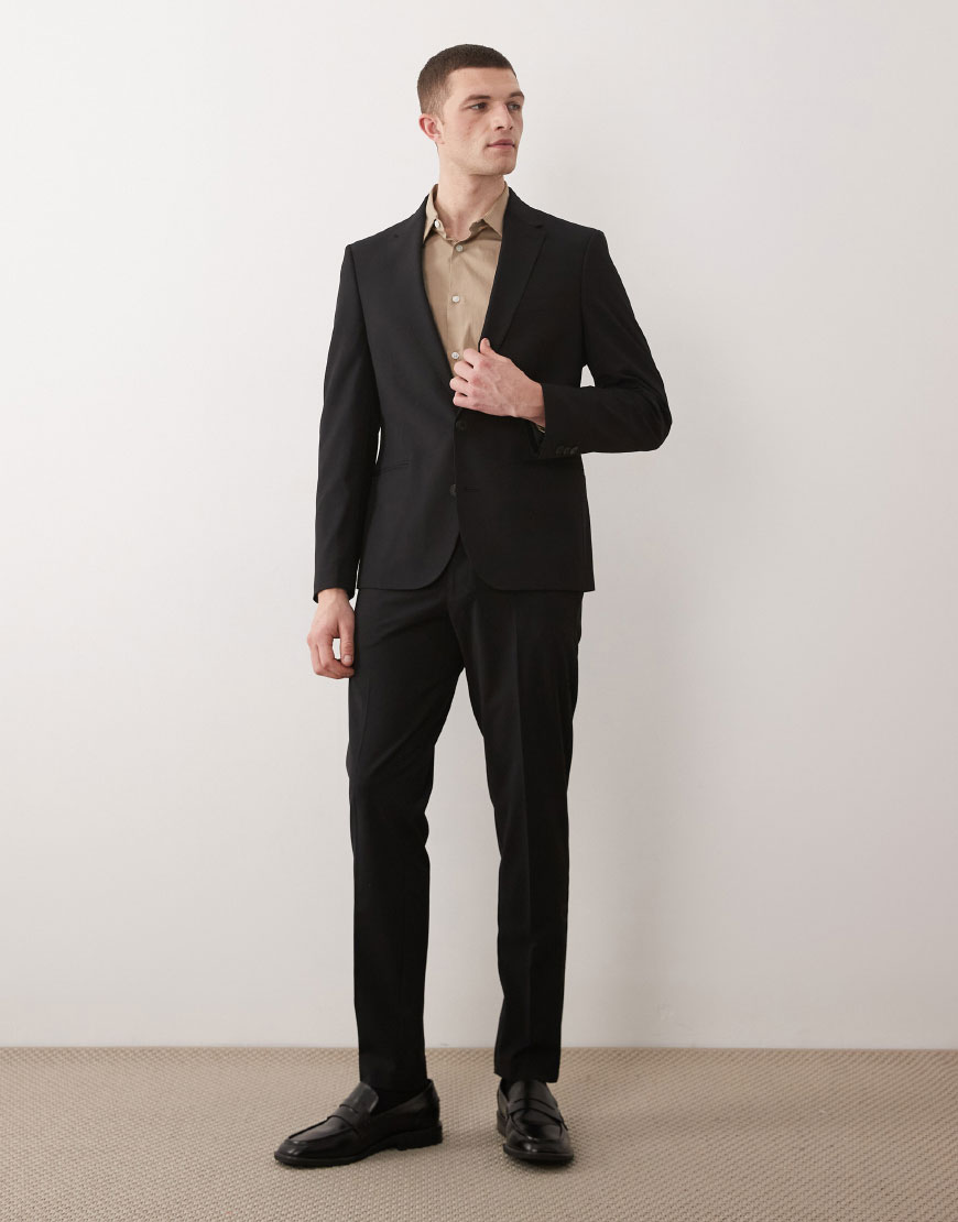 A man wearing a black suit | ASOS