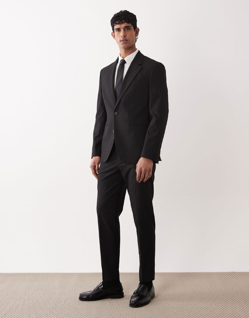 A man wearing a black suit | ASOS