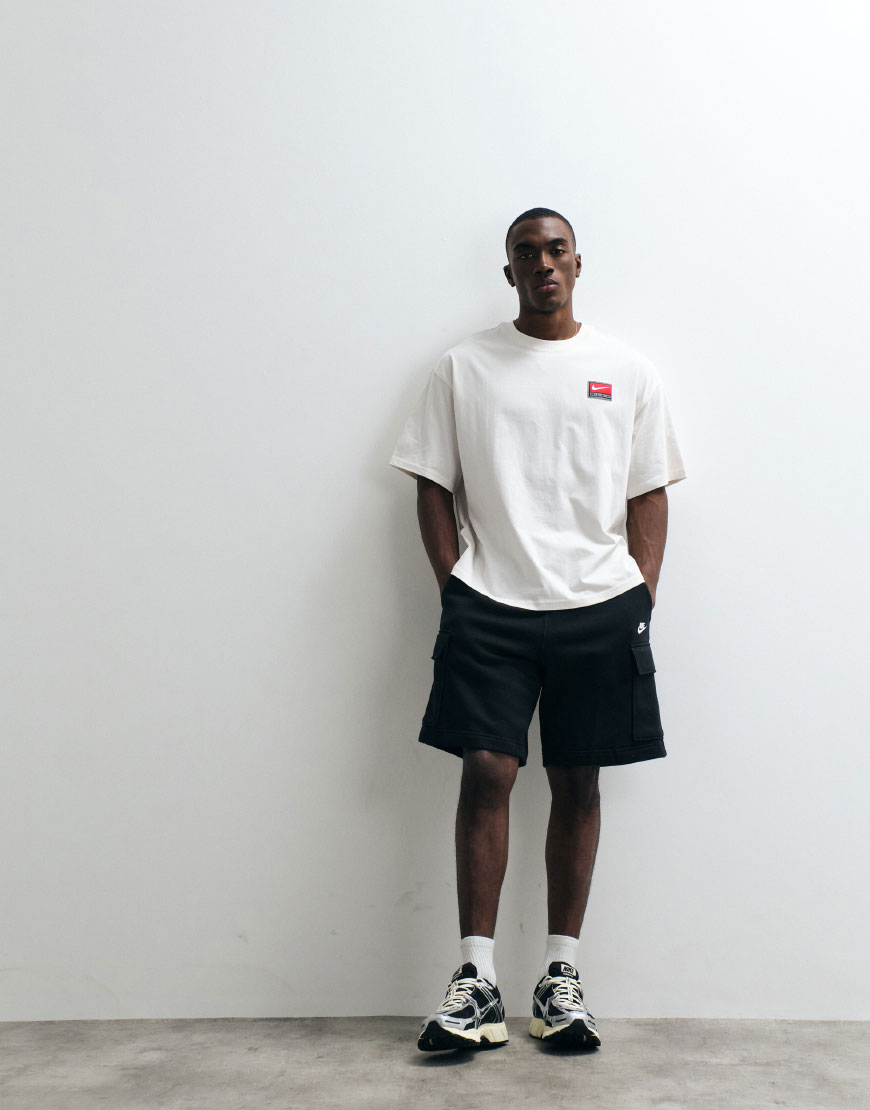 A man wearing black cargo shorts | ASOS