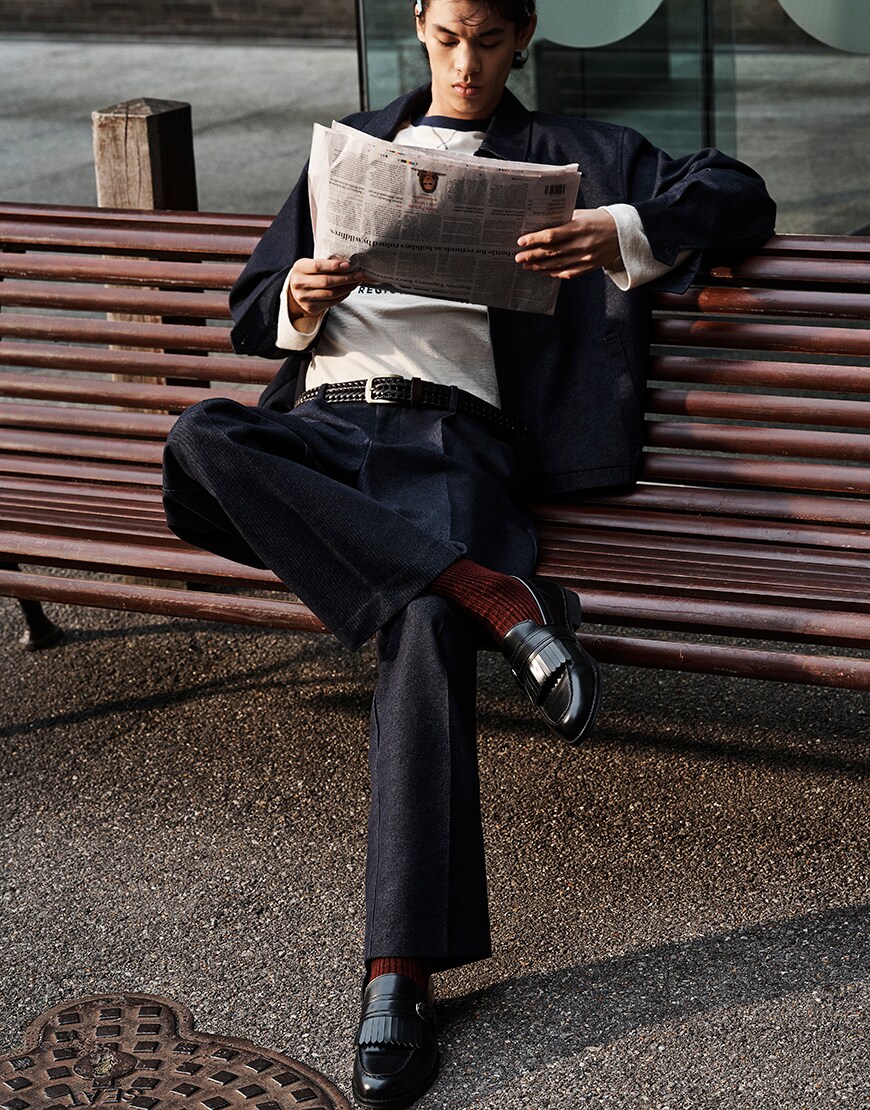 Man wearing dark suit with pink socks and loafers | ASOS Style Feed