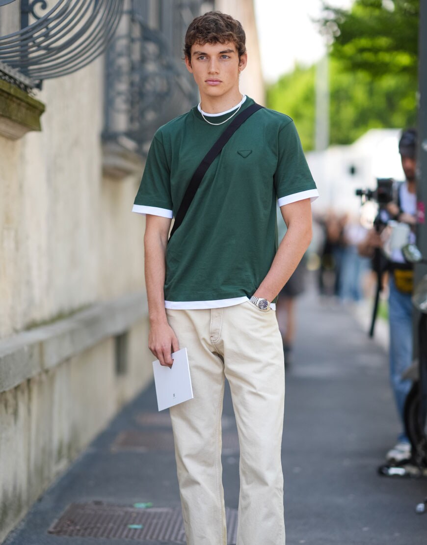 Man Wearing a T-shirt and Trousers