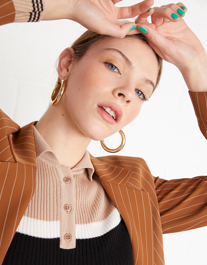 A model in a ribbed polo and striped blazer | ASOS Style Feed
