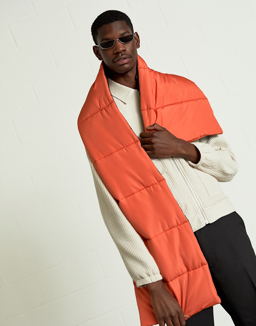 A model wearing a cream zip jacket, shades and an emergency-orange scarf | ASOS Style Feed