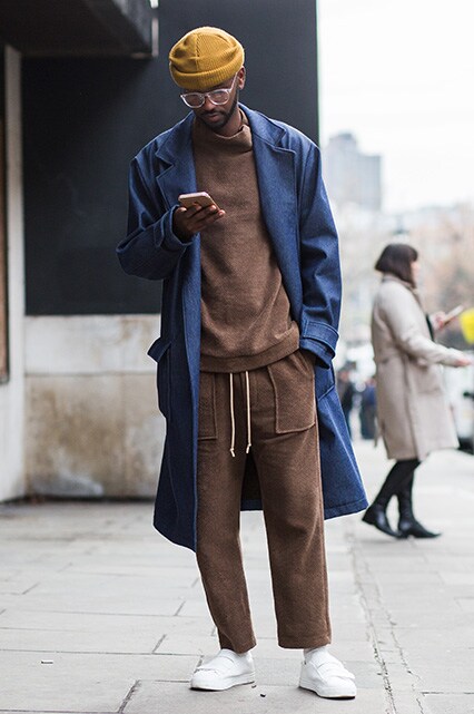 Street-styler in a brown tracksuit with a structured coat and beanie | ASOS Style Feed